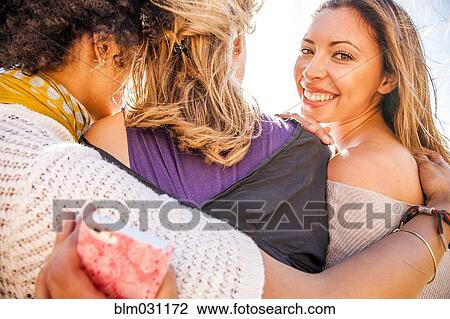 Women standing together outdoors View Large Photo Image Stock Image - Women standing together outdoors. Fotosearch