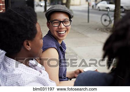 Stock Photo - Women talking on city street. Fotosearch