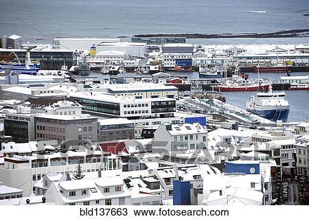 Stock Image - Aerial view of cityscape and ocean, Reykjavik, Hofudborgarsvaedi, Iceland. Fotosearch