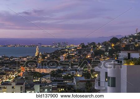 Aerial view of illuminated cityscape at dusk View Large Photo Image Stock Image - Aerial view of illuminated cityscape at dusk. Fotosearch