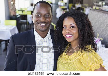 African American couple smiling in restaurant View Large Photo Image Stock Image - African American couple smiling in restaurant. Fotosearch