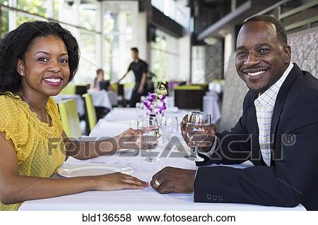 African American couple smiling in restaurant View Large Photo Image Stock Photo - African American couple smiling in restaurant. Fotosearch