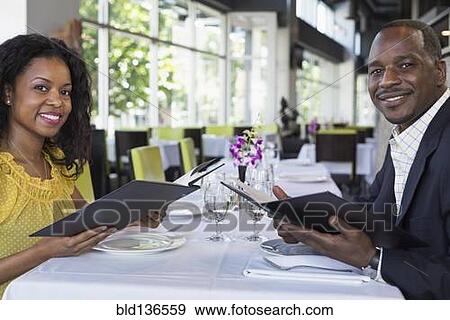 African American couple smiling in restaurant View Large Photo Image Stock Photo - African American couple smiling in restaurant. Fotosearch