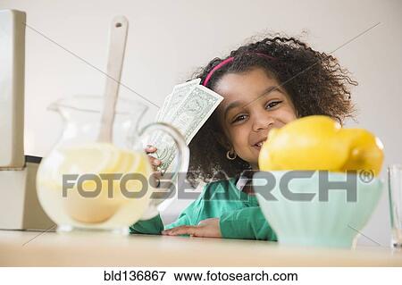 Stock Photo - African American girl selling lemonade. Fotosearch