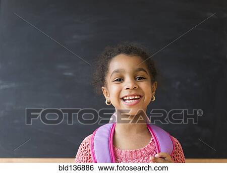 African American girl smiling in classroom View Large Photo Image Stock Photograph - African American girl smiling in classroom. Fotosearch