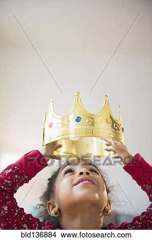 African American girl wearing gold crown View Large Photo Image Picture - African American girl wearing gold crown. Fotosearch