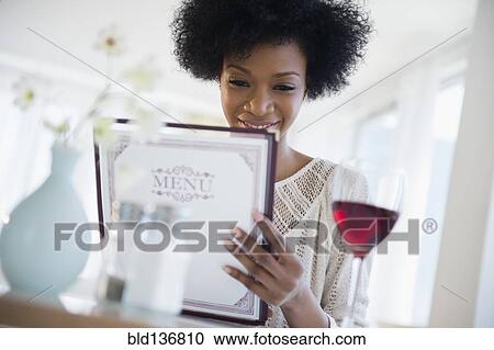 African American people reading menu at restaurant View Large Photo Image Stock Image - African American people reading menu at restaurant. Fotosearch