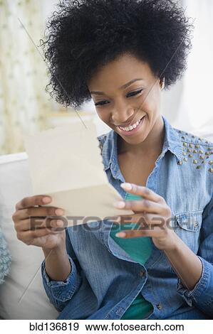 African American woman reading letter View Large Photo Image Stock Photo - African American woman reading letter. Fotosearch
