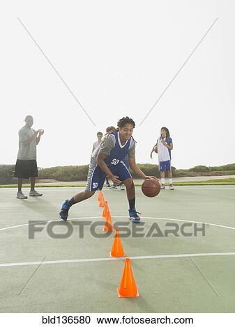 Basketball team doing drills at practice View Large Photo Image Stock Image - Basketball team doing drills at practice. Fotosearch