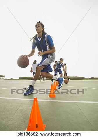 Basketball team doing drills at practice View Large Photo Image Stock Image - Basketball team doing drills at practice. Fotosearch
