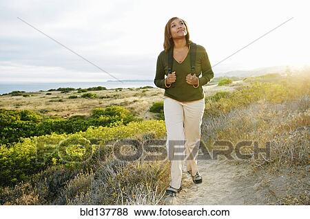 Black woman standing on rural hillside View Large Photo Image Stock Photo - Black woman standing on rural hillside. Fotosearch