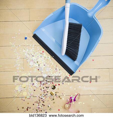 Broom and dustpan with confetti on floor View Large Photo Image Stock Image - Broom and dustpan with confetti on floor. Fotosearch