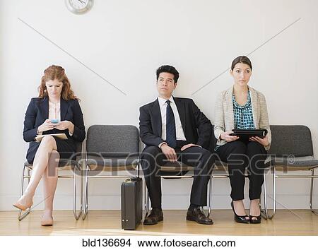 Picture - Business people in office waiting room. Fotosearch