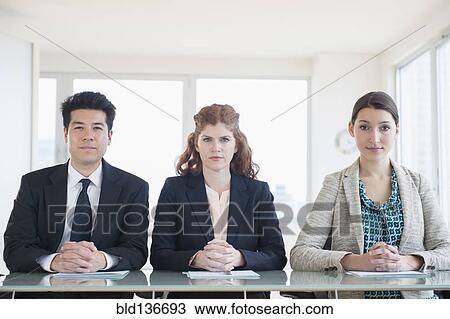 Business people sitting in meeting View Large Photo Image Stock Image - Business people sitting in meeting. Fotosearch