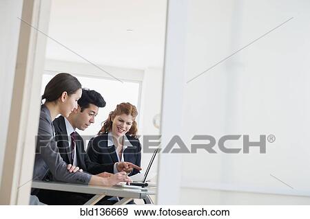 Business people talking in meeting View Large Photo Image Stock Photo - Business people talking in meeting. Fotosearch
