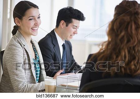 Stock Photo - Business people talking in meeting. Fotosearch