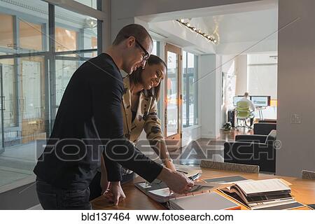Business people working in conference room View Large Photo Image Picture - Business people working in conference room. Fotosearch