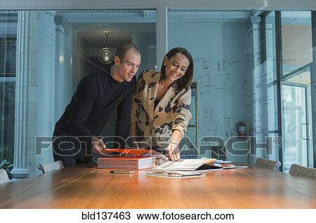 Business people working in conference room View Large Photo Image Stock Image - Business people working in conference room. Fotosearch