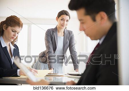 Stock Photograph - Business people working in office. Fotosearch