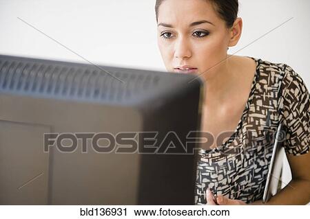 Businesswoman working at computer View Large Photo Image Stock Image - Businesswoman working at computer. Fotosearch