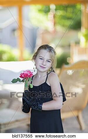 Caucasian girl playing dress-up on porch View Large Photo Image Stock Photography - Caucasian girl playing dress-up on porch. Fotosearch