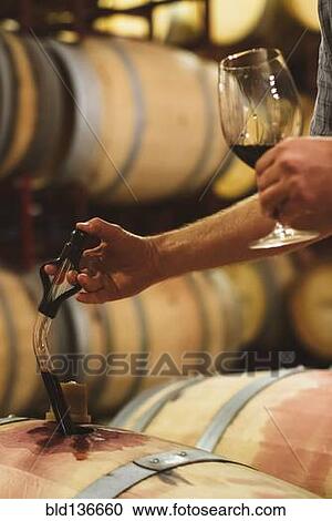 Caucasian man tasting wine View Large Photo Image Stock Image - Caucasian man tasting wine. Fotosearch