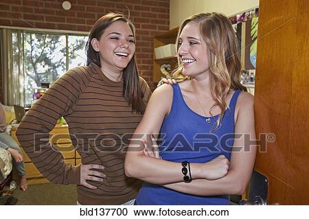 Caucasian students smiling in dorm room View Large Photo Image Stock Image - Caucasian students smiling in dorm room. Fotosearch
