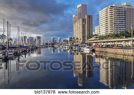 Cityscape and harbor reflected in urban bay, Honolulu, Hawaii, United States View Large Photo Image Stock Photo - Cityscape and harbor reflected in urban bay, Honolulu, Hawaii, United States. Fotosearch