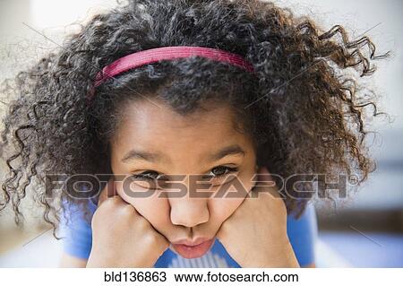 Close up of African American girl making a face View Large Photo Image Stock Image - Close up of African American girl making a face. Fotosearch