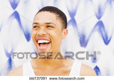 Close up of African American man smiling View Large Photo Image Stock Image - Close up of African American man smiling. Fotosearch