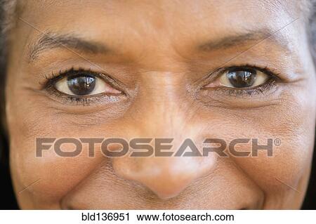 Close up of mixed race woman smiling View Large Photo Image Stock Image - Close up of mixed race woman smiling. Fotosearch