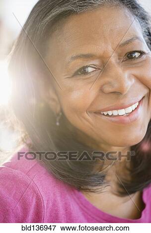 Close up of mixed race woman smiling View Large Photo Image Stock Photo - Close up of mixed race woman smiling. Fotosearch