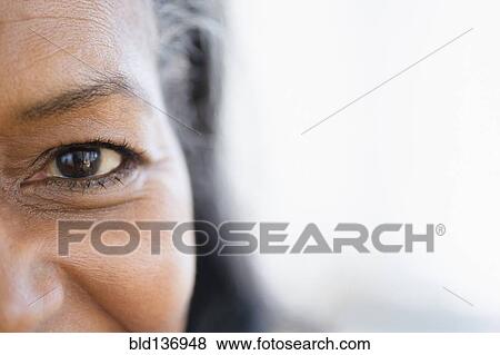 Stock Photo - Close up of mixed race woman's eye. Fotosearch
