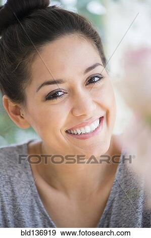 Stock Photo - Close up of woman smiling. Fotosearch