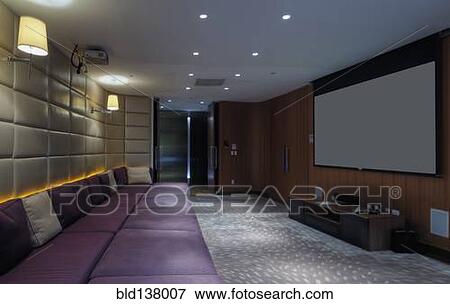 Couch and screen in home theater room View Large Photo Image Stock Photo - Couch and screen in home theater room. Fotosearch