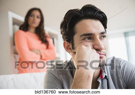 Stock Image - Couple arguing in living room. Fotosearch