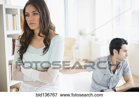 Stock Photo - Couple arguing in living room. Fotosearch