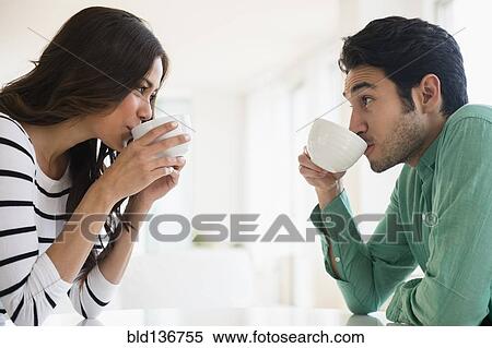 Couple drinking coffee together View Large Photo Image Stock Photography - Couple drinking coffee together. Fotosearch