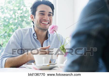 Stock Image - Couple eating breakfast together. Fotosearch