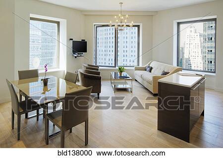Dining table and sofa in urban apartment View Large Photo Image Stock Image - Dining table and sofa in urban apartment. Fotosearch