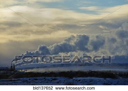 Stock Image - Distant power plant in arctic landscape. Fotosearch