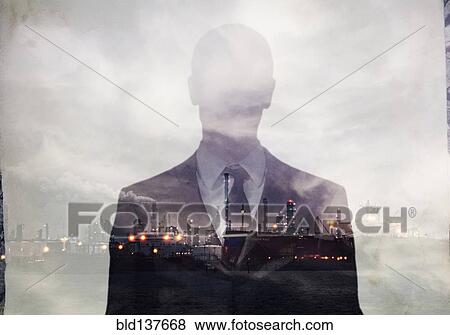 Stock Photo - Double exposure of businessman and power plant. Fotosearch
