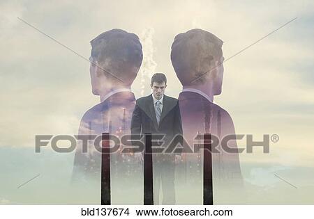 Double exposure of businessmen and smoke stacks View Large Photo Image Picture - Double exposure of businessmen and smoke stacks. Fotosearch