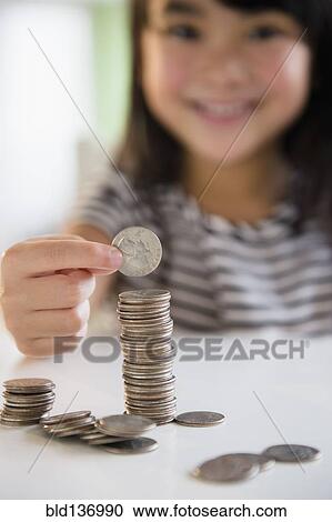 Filipino girl counting coins View Large Photo Image Stock Image - Filipino girl counting coins. Fotosearch