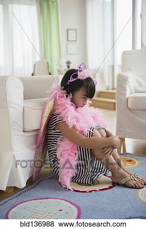 Filipino girl playing dress-up in living room View Large Photo Image Stock Photo - Filipino girl playing dress-up in living room. Fotosearch