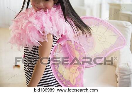 Filipino girl playing dress-up in living room View Large Photo Image Stock Photo - Filipino girl playing dress-up in living room. Fotosearch