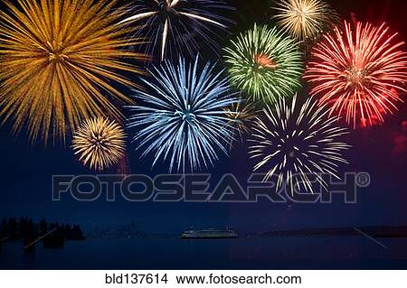 Picture - Fireworks exploding over cruise ship in bay, Seattle, Washington, United States. Fotosearch