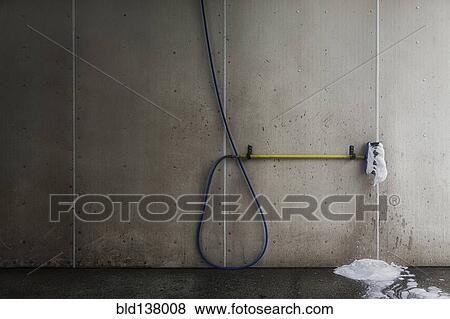 Foaming brush with hose in car wash View Large Photo Image Stock Photo - Foaming brush with hose in car wash. Fotosearch
