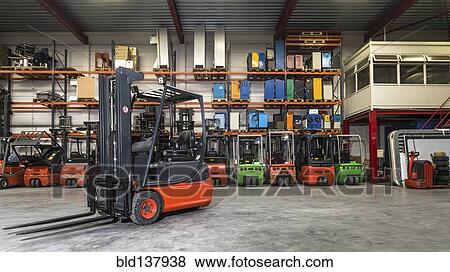 Forklift machinery in warehouse View Large Photo Image Stock Photo - Forklift machinery in warehouse. Fotosearch