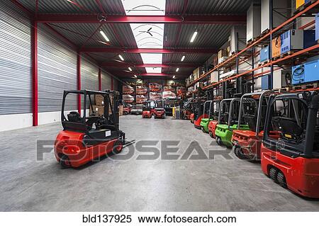 Stock Photography - Forklift machinery working in warehouse. Fotosearch